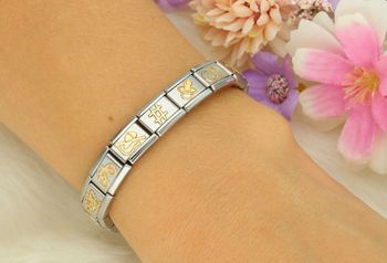 4Złota zawieszka Nomination 'Smoczek' 030109 07 z kolekcji Link 18K – stal szlachetna i 18K złoto. Idealna pamiątka na narodziny dziecka lub prezent dla mamy. Spersonalizuj bransoletkę! (3).jpg